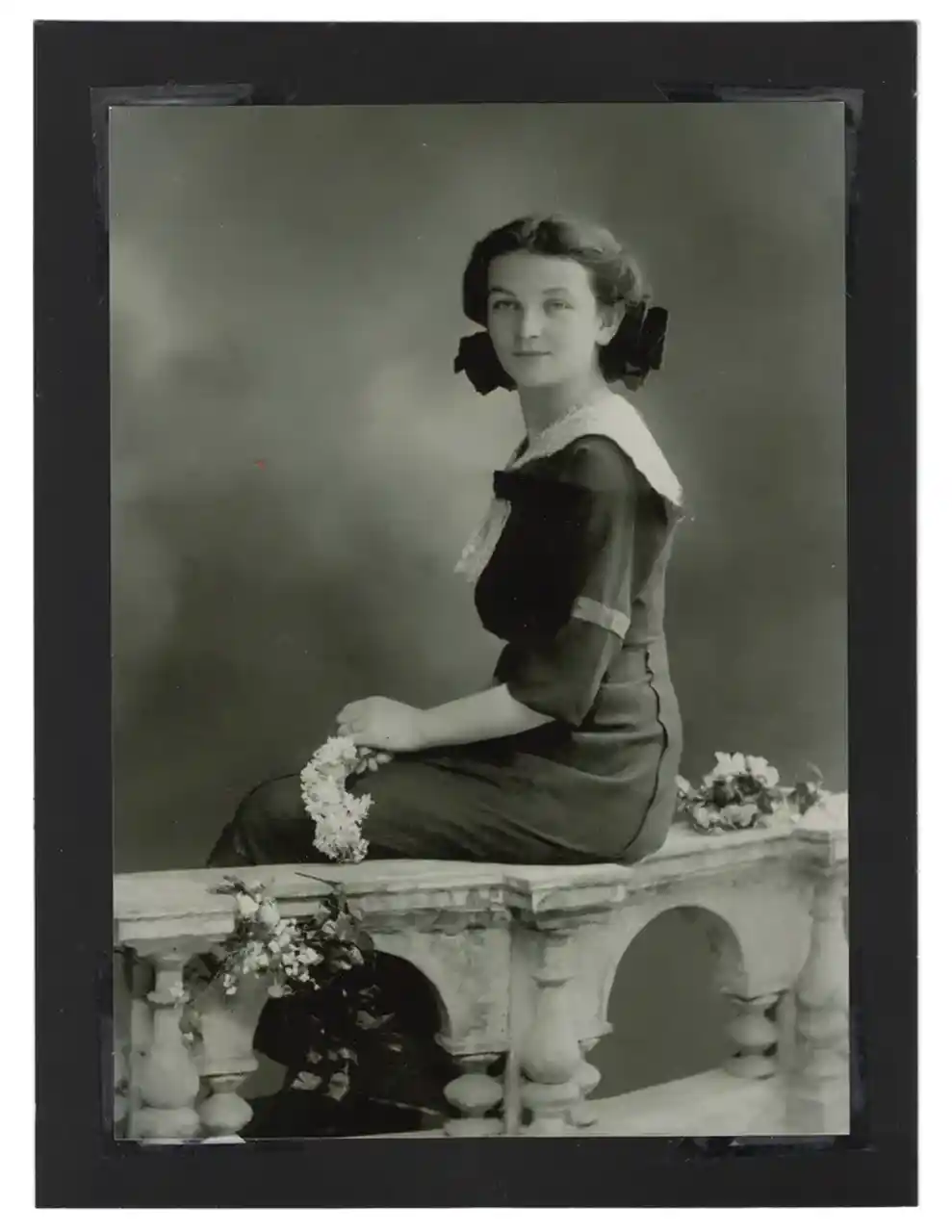 Mounted studio portrait of a young woman.